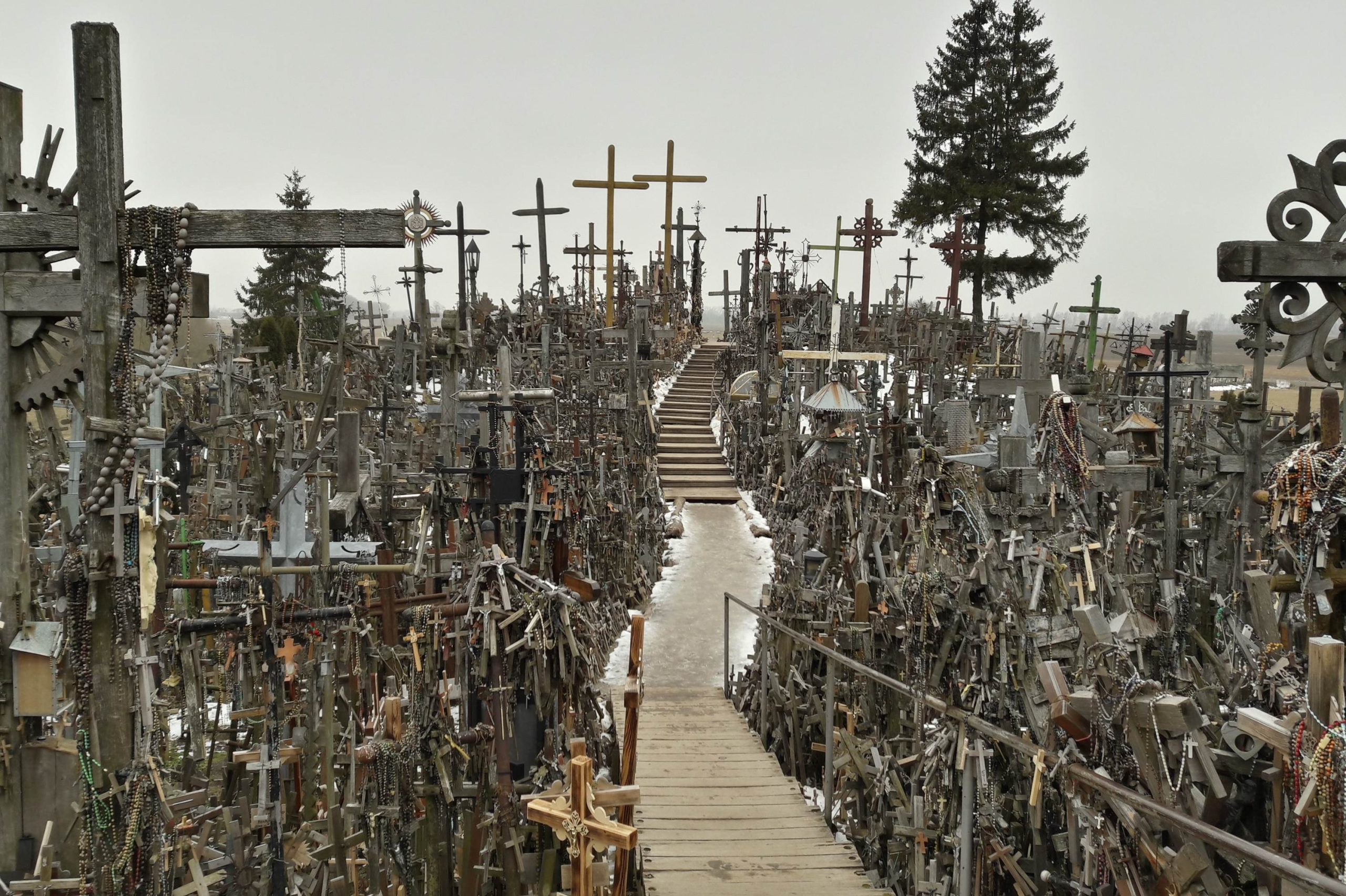 Hill of crosses surrounded by a number of impressive crosses.