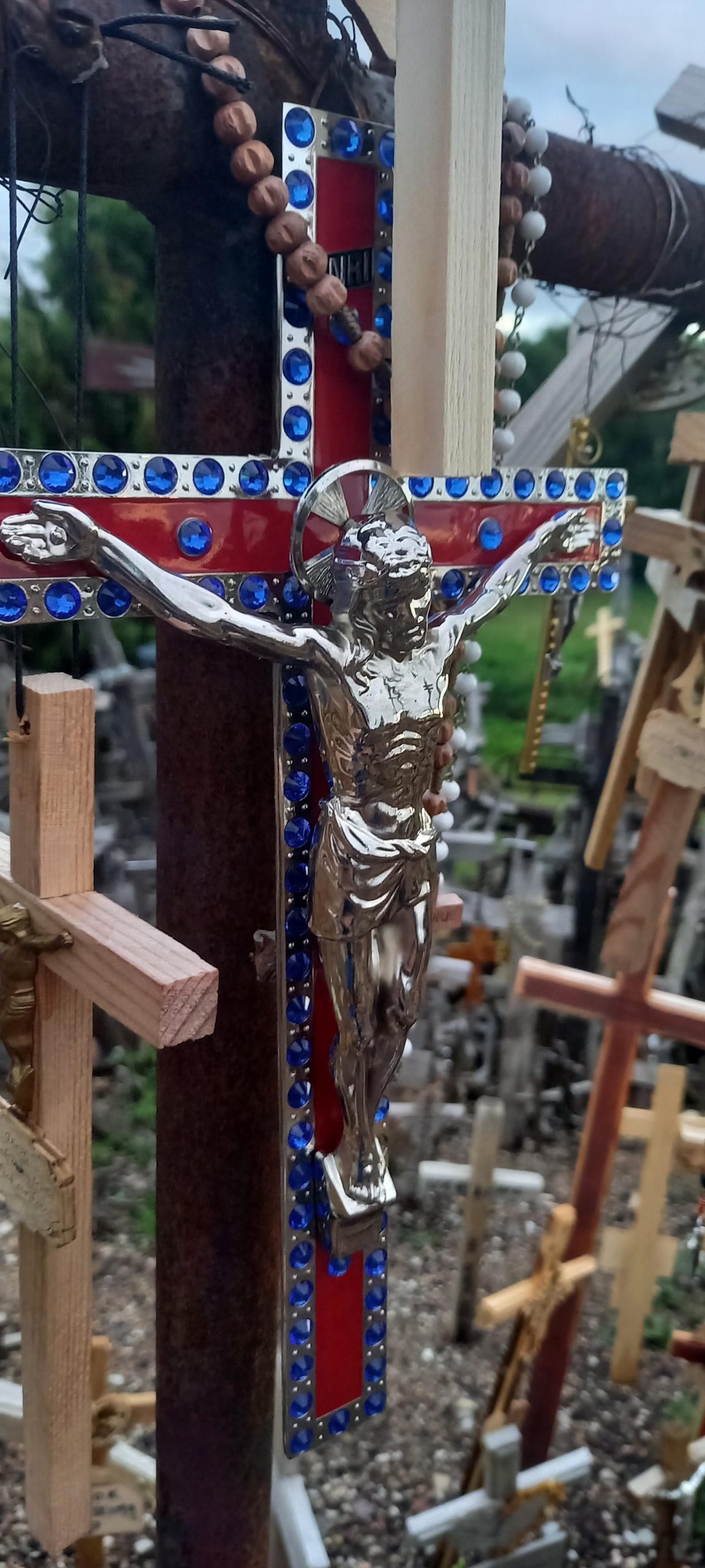 Silver cross rosary on the Hill of crosses
